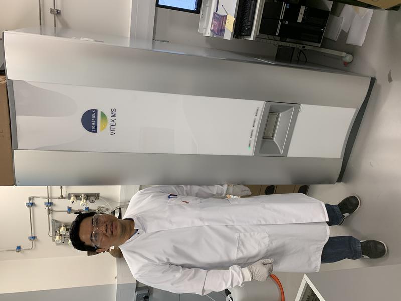 Lead author and DPhil student Yohan Arman Lead author and DPhil student Yohan Arman next to the Biomerieux Vitek MS used in this study